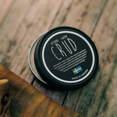 Close-up of Crud leather wax in matte black aluminium container