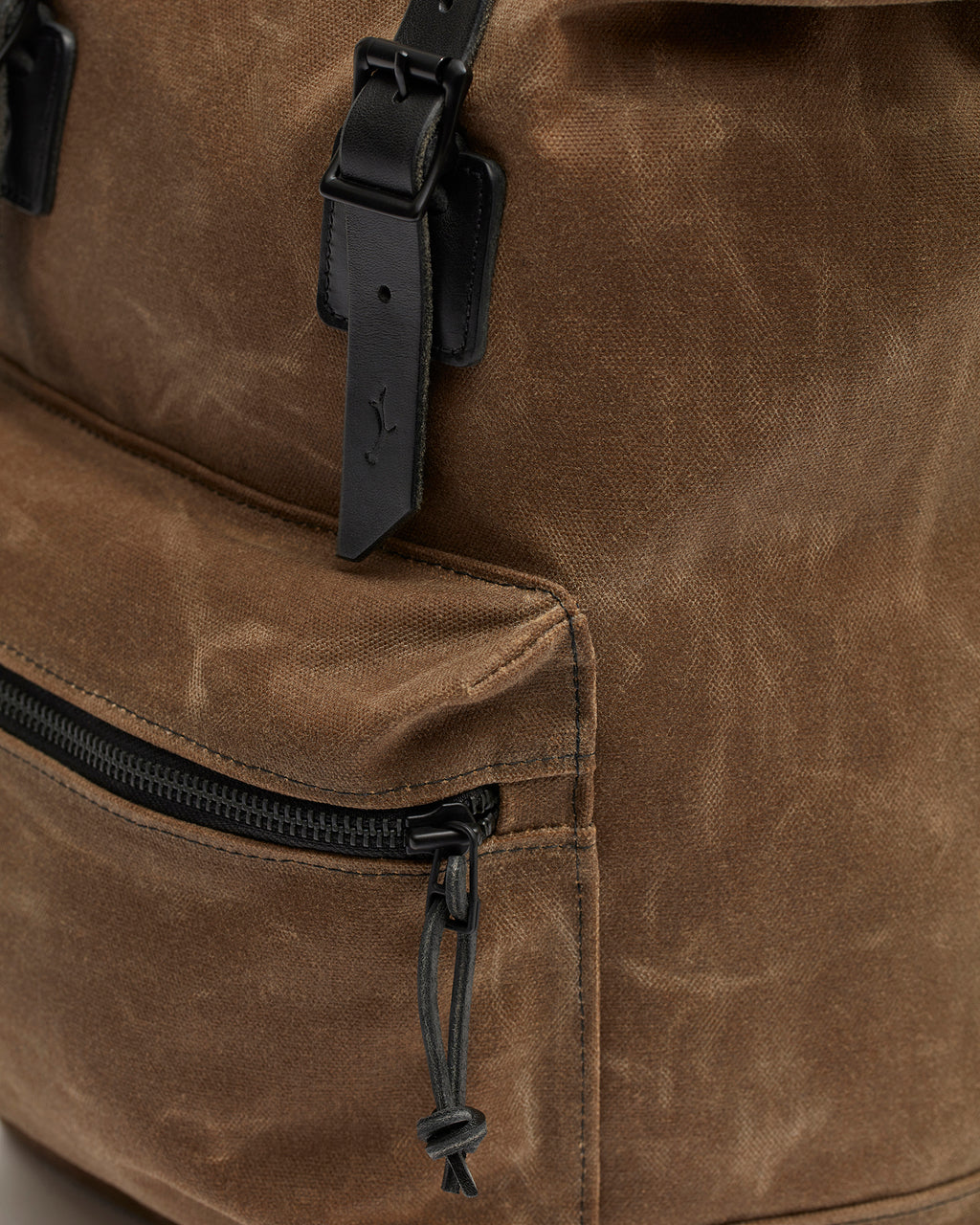 Roll top backpack with leather details and padded back