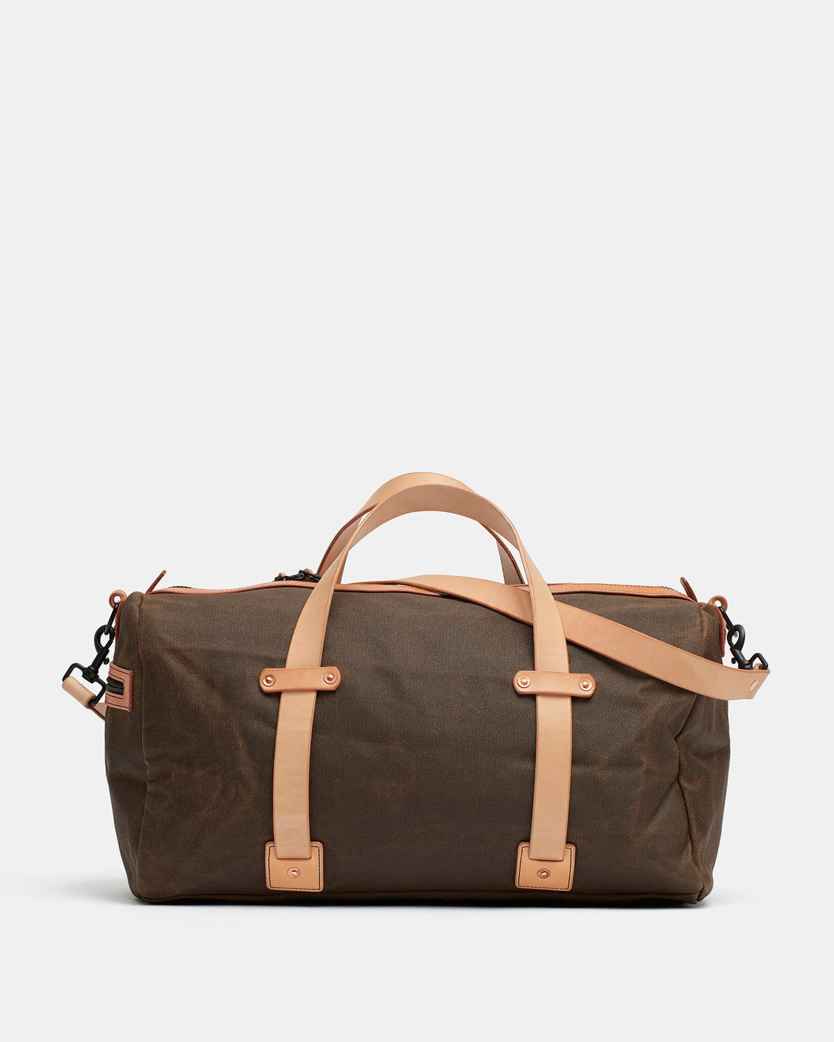 Natural waxed canvas duffel bag with heavy leather straps and brass hardware
