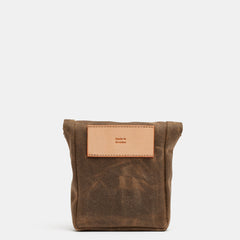Leather hip pouch with waxed canvas and snap button closure